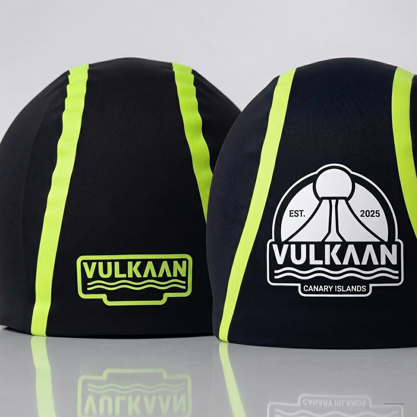 Pack Duo VULKAAN - dos sotocascos técnicos vista frontal y trasera con logo Vulkaan Canary Islands